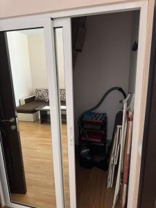 a room with a door open to a room with a couch at Центр солнечного берега in Sunny Beach
