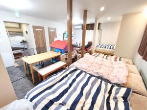 Katil atau katil-katil dalam bilik di BBQ 夏季プール マッサージチェア 舞子スノーリゾート 加賀屋旅館 南魚沼 Kagaya Ryokan 加贺屋旅馆