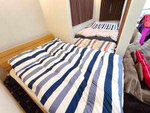 Katil atau katil-katil dalam bilik di BBQ 夏季プール マッサージチェア 舞子スノーリゾート 加賀屋旅館 南魚沼 Kagaya Ryokan 加贺屋旅馆