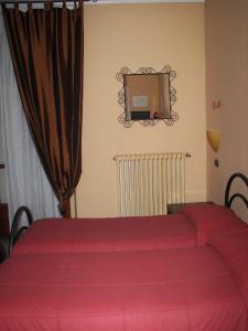 Postel nebo postele na pokoji v ubytování Albergo Sangrilà