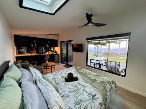 a living room with a couch and a ceiling fan at Bluestone Ridge in Whitfield