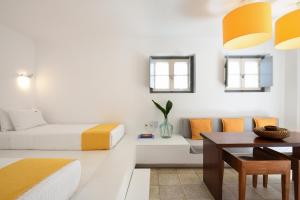 a living room with a bed and a table at Orloff Resort in Spetses