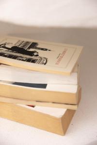 a stack of books sitting next to each other at Mediterranean Suite in Ardèche in Saint-Georges-les-Bains