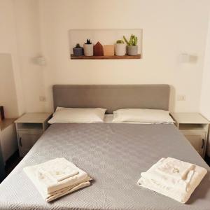 A bed or beds in a room at Largo Otranto - Guest House