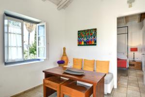 a living room with a table and a couch at Orloff Resort in Spetses