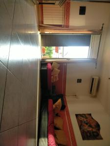 a small room with a staircase in a bathroom at Etna House in Santa Maria di Licodia