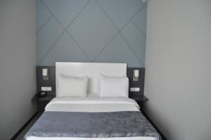 Postel nebo postele na pokoji v ubytování Cavit Duvan Prestige Hotel
