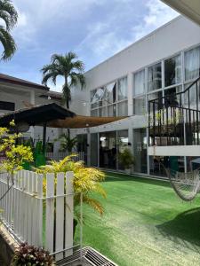 an exterior view of a building with a lawn at Seabird International Resort in Boracay