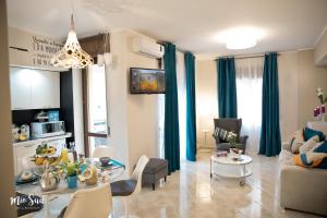 a living room with a couch and a table at Mio Sud in Cosenza
