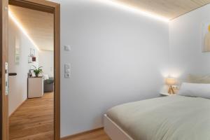 Letto o letti in una camera di KopfRausch Appartements