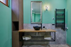a bathroom with a sink and a mirror at Florance Rentals Luxury Apartments in Nessebar in Nesebar +116 photos