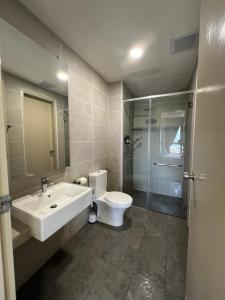 a bathroom with a sink and a toilet and a shower at Luxury & Lovely studio with waterpark in town in Melaka