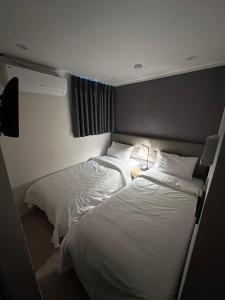 Postel nebo postele na pokoji v ubytování About Stay Dongdaemun