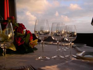 a group of wine glasses sitting on a table at Hotel Miradouro in Porto