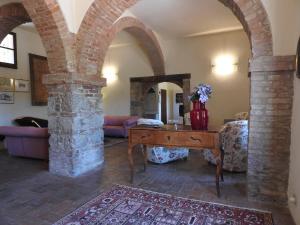 Posedenie v ubytovaní Relais Borgo Di Toiano
