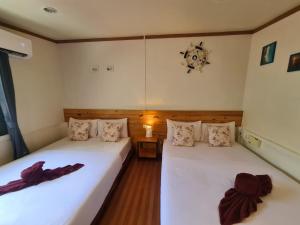 Letto o letti in una camera di Baan Hello Samed