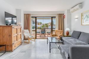TV a/nebo společenská místnost v ubytování Apartamento Puebla Lucia Fuengirola
