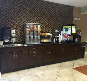 a kitchen with a counter with some food on it at Microtel by Wyndham Perry National Fairground Area I-75 in Perry