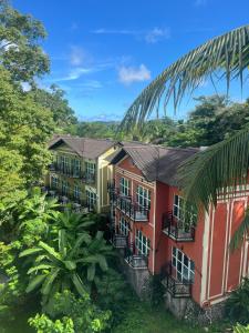 a row of houses in the jungle at Munjoh Island House Suites and Spa, Port Blair in Port Blair