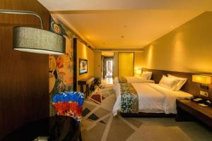 Postel nebo postele na pokoji v ubytování Zmax Changzhi Bayi Square + 270 fotografií