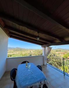 a table on a balcony with a view at Appartamento MareNatura in Cardedu +30 photos