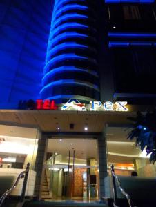 a high rise building with a sign on it at Hotel Apex Intercontinental in Jaipur