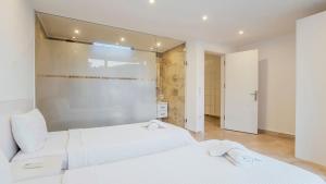 A bed or beds in a room at Villa Zeytouna