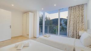 A bed or beds in a room at Villa Zeytouna
