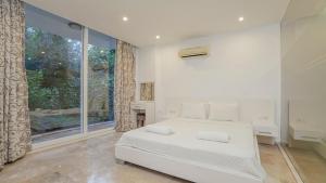 A bed or beds in a room at Villa Zeytouna