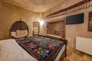 TV a/nebo společenská místnost v ubytování My Story Cave Hotel