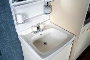 a bathroom sink in an airplane bathroom vanity at Silk Court 301 in Chitose
