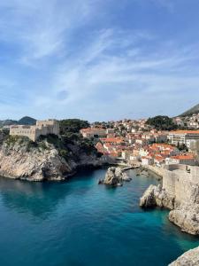 an aerial view of a city and a body of water at Apartment by CITY WALLS perfect for 2 in Dubrovnik