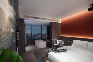 Postel nebo postele na pokoji v ubytování Enji M Hotel-Xi’an datangbuyecheng