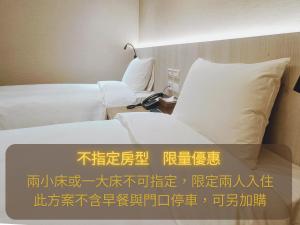 Postel nebo postele na pokoji v ubytování 衿后禾居Good Hotel