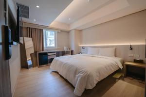 Postel nebo postele na pokoji v ubytování 衿后禾居Good Hotel