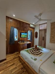 TV a/nebo společenská místnost v ubytování Jungle Haven Resort Central Ubud