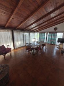 a large dining room with a table and chairs at Apartament vila Roma in Eforie Nord