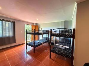 Postel nebo postele na pokoji v ubytování Cama Lodge
