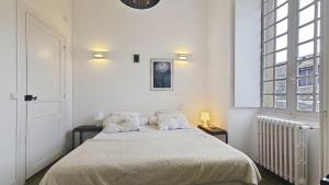 Ένα ή περισσότερα κρεβάτια σε δωμάτιο στο Appartement Maison Eugenie