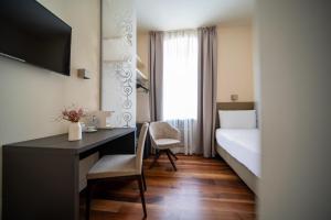 Postel nebo postele na pokoji v ubytování Hotel Vis à Vis