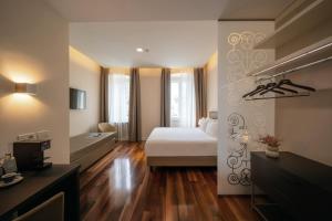 Postel nebo postele na pokoji v ubytování Hotel Vis à Vis