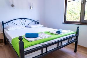 Postel nebo postele na pokoji v ubytování Бунгала - Камчия - Електрон Универс