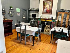 a restaurant with tables and chairs in a room at Thyme and Again B&B Estcourt in Estcourt +8 photos