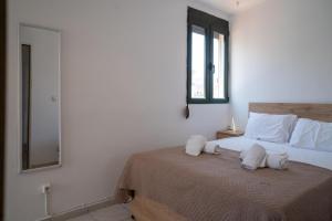 Ένα ή περισσότερα κρεβάτια σε δωμάτιο στο Heraklion City Breeze