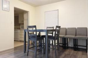 a dining room table and chairs in a kitchen at 2 Or 3 Bedroom Condo Walk To Mgm Casino And Strip in Las Vegas