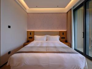 Ruolinqiao Valley Garden Hotel客房内的一张或多张床位