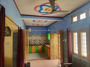 a room with a ceiling with a painting on it at Hill View 1BHK in Uttarkashi in Uttarkāshi