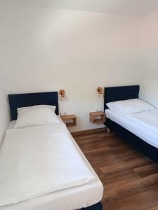 Postel nebo postele na pokoji v ubytování Apartamenty Allan