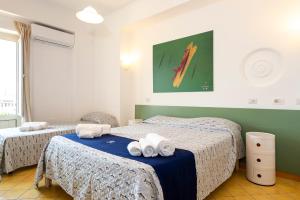 Postel nebo postele na pokoji v ubytování Hotel Villa Rita