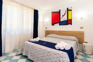 Postel nebo postele na pokoji v ubytování Hotel Villa Rita